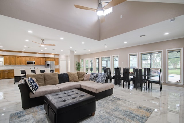 2616 Ryder Ct, League City, TX 77573 - living area featuring a ceiling fan, light marble finish floors, recessed lighting, plenty of natural light, and crown molding