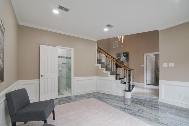2616 Ryder Ct, League City, TX 77573 - sitting room with ornamental molding, stairs, a decorative wall, wainscoting, and recessed lighting