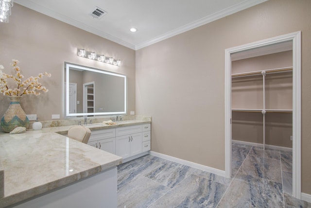 2616 Ryder Ct, League City, TX 77573 - full bathroom featuring double vanity, crown molding, a walk in closet, marble look tile flooring, and baseboards