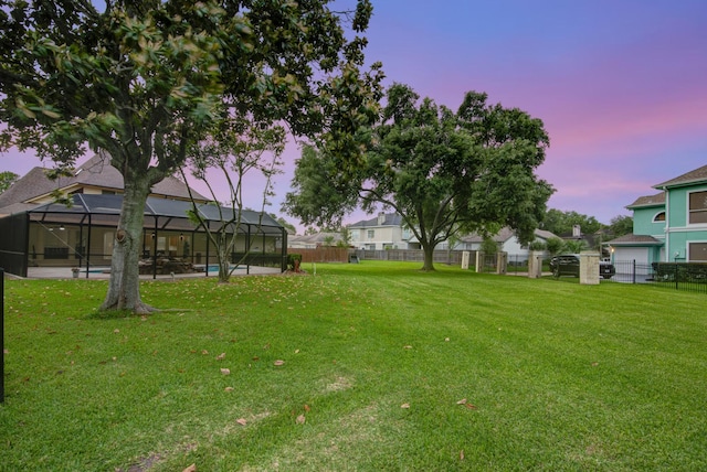 2616 Ryder Ct, League City, TX 77573 - yard at dusk featuring a lanai