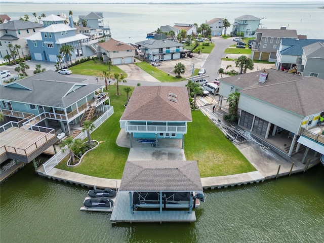 1322 Oahu Dr, Tiki Island, TX 77554 - aerial view of residential area with a large body of water