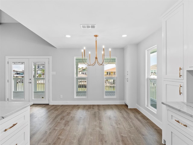 1322 Oahu Dr, Tiki Island, TX 77554 - unfurnished dining area featuring light wood finished floors, a chandelier, baseboards, recessed lighting, and french doors
