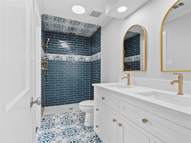 1322 Oahu Dr, Tiki Island, TX 77554 - full bath with toilet, tiled shower, tile patterned floors, and double vanity