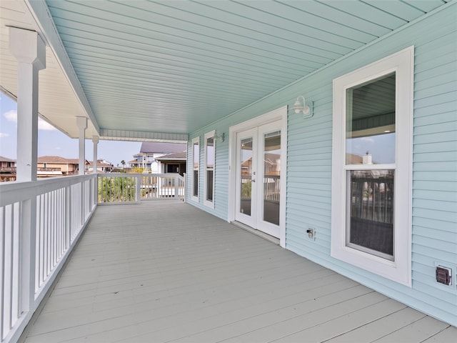 1322 Oahu Dr, Tiki Island, TX 77554 - wooden terrace featuring french doors and a residential view