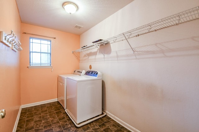 15522 Noble Brook Ct, Houston, TX 77049 - washroom featuring washing machine and dryer and baseboards