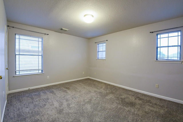 15522 Noble Brook Ct, Houston, TX 77049 - carpeted spare room featuring baseboards and a textured ceiling