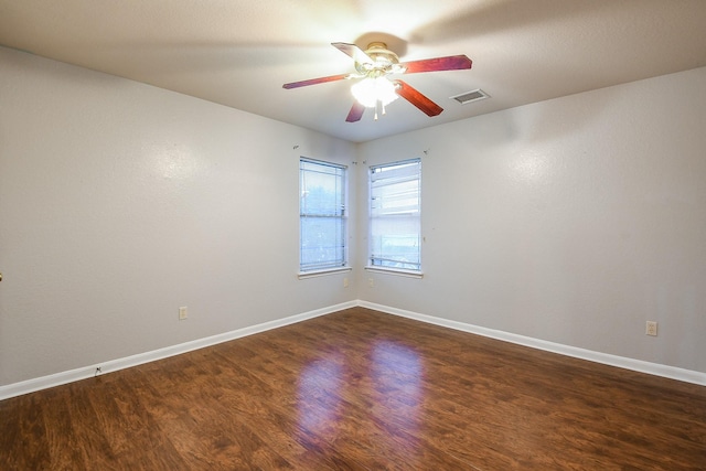 15522 Noble Brook Ct, Houston, TX 77049 - empty room with ceiling fan, dark wood-style floors, and baseboards