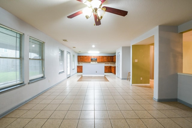 15522 Noble Brook Ct, Houston, TX 77049 - unfurnished living room with light tile patterned floors, ceiling fan, and baseboards