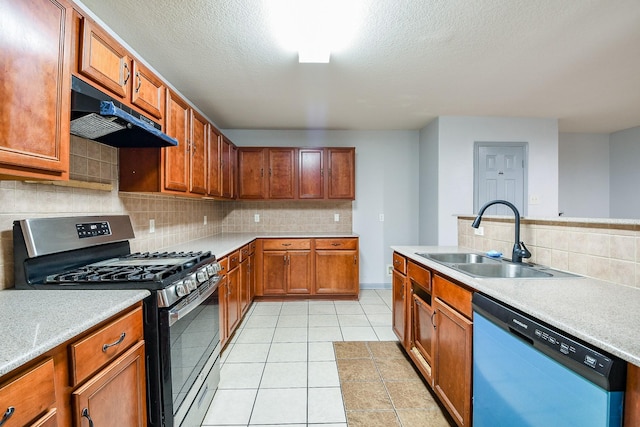 15522 Noble Brook Ct, Houston, TX 77049 - kitchen with gas stove, dishwasher, a sink, under cabinet range hood, and tasteful backsplash