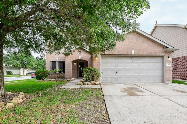 15522 Noble Brook Ct, Houston, TX 77049 - view of front of property featuring brick siding, driveway, a garage, and a front yard