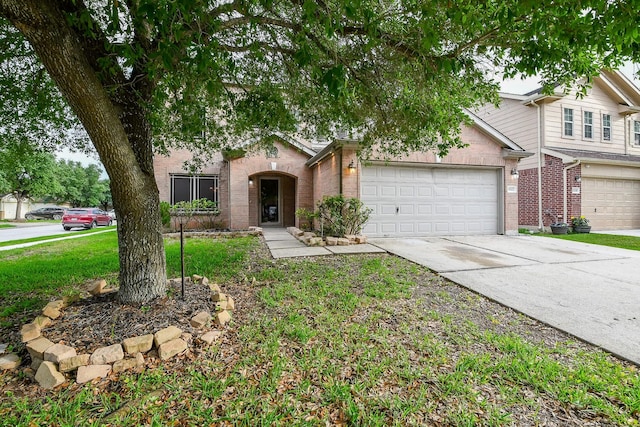 15522 Noble Brook Ct, Houston, TX 77049 - view of front of property with brick siding, driveway, an attached garage, and a front yard