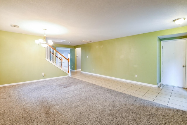 15522 Noble Brook Ct, Houston, TX 77049 - empty room with light colored carpet, light tile patterned floors, a chandelier, stairway, and baseboards