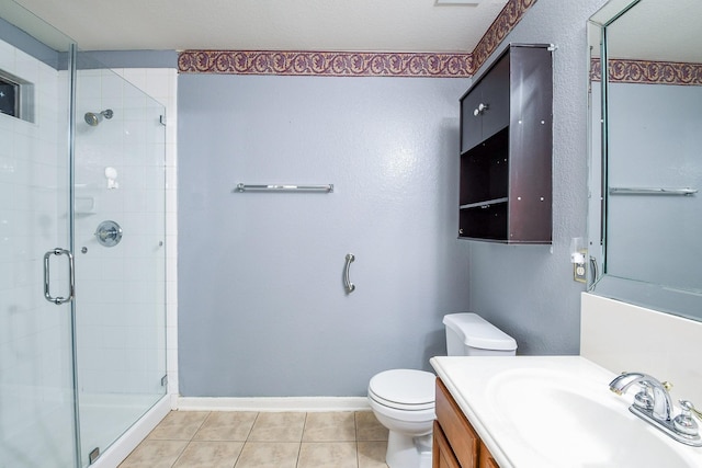 15522 Noble Brook Ct, Houston, TX 77049 - bathroom featuring a stall shower, vanity, toilet, tile patterned floors, and baseboards