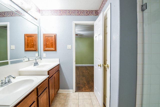 15522 Noble Brook Ct, Houston, TX 77049 - bathroom featuring two vanities and tile patterned flooring
