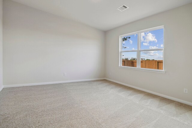 15854 Berry Hill Dr, Conroe, TX 77303 - spare room with light colored carpet and baseboards