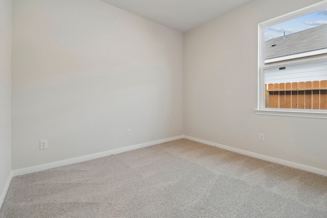 15854 Berry Hill Dr, Conroe, TX 77303 - carpeted empty room with baseboards