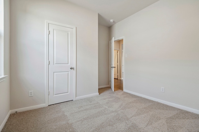 15854 Berry Hill Dr, Conroe, TX 77303 - unfurnished bedroom featuring light colored carpet and baseboards