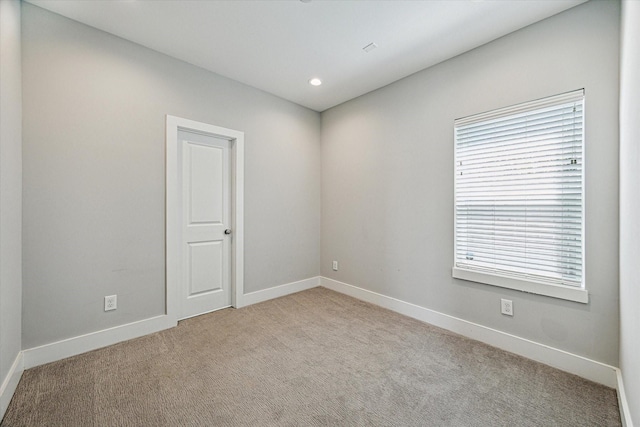 622 Janisch Rd Unit A, Houston, TX 77018 - empty room featuring carpet flooring, baseboards, and recessed lighting