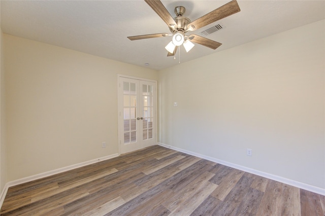 unfurnished room with french doors, wood finished floors, ceiling fan, and baseboards