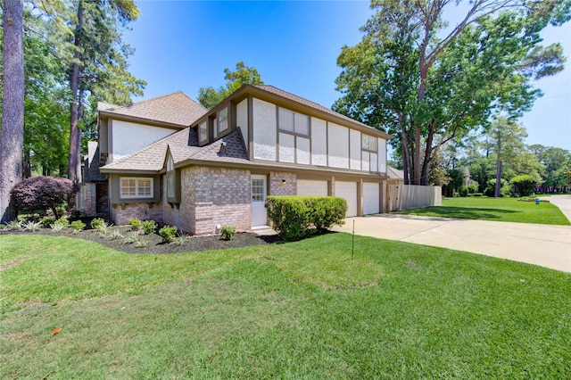 view of front facade with a garage, concrete driveway, stucco siding, brick siding, and roof with shingles
