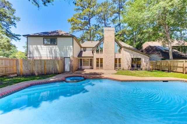 view of swimming pool with a pool with connected hot tub and a patio