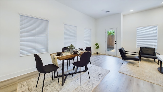 3019 Jensen Springs Ln, Houston, TX 77026 - dining space with wood finished floors, recessed lighting, and baseboards