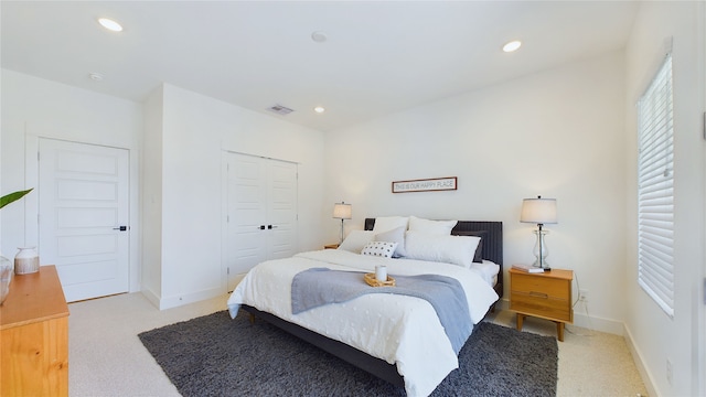 3019 Jensen Springs Ln, Houston, TX 77026 - bedroom with light carpet, recessed lighting, a closet, and baseboards