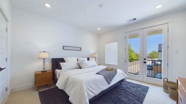 3019 Jensen Springs Ln, Houston, TX 77026 - bedroom featuring french doors, light carpet, access to exterior, recessed lighting, and baseboards