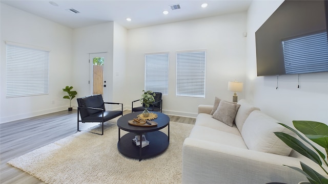 3019 Jensen Springs Ln, Houston, TX 77026 - living room with wood finished floors, baseboards, and recessed lighting