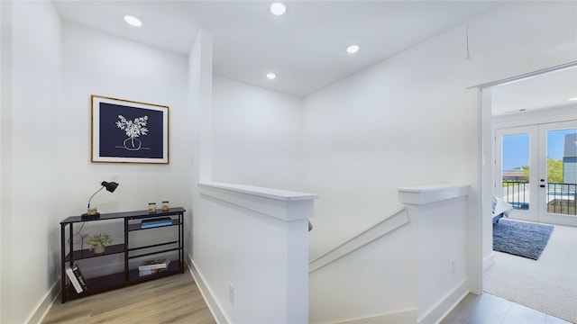 3019 Jensen Springs Ln, Houston, TX 77026 - hall with an upstairs landing, french doors, recessed lighting, baseboards, and wood finished floors