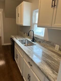 3109 Anita St, Houston, TX 77004 - kitchen with a sink, light countertops, white cabinets, and dark wood finished floors