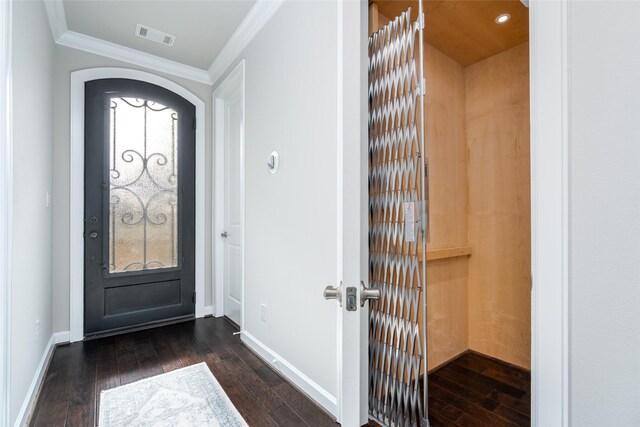 831 Dunleigh Meadows Ln, Houston, TX 77055 - entrance foyer with dark wood-type flooring, crown molding, baseboards, and arched walkways