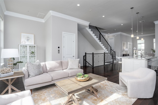 831 Dunleigh Meadows Ln, Houston, TX 77055 - living area featuring dark wood-style flooring, stairway, crown molding, and recessed lighting