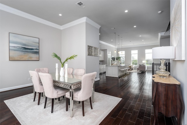 831 Dunleigh Meadows Ln, Houston, TX 77055 - dining area featuring dark wood-style floors, recessed lighting, ornamental molding, and baseboards