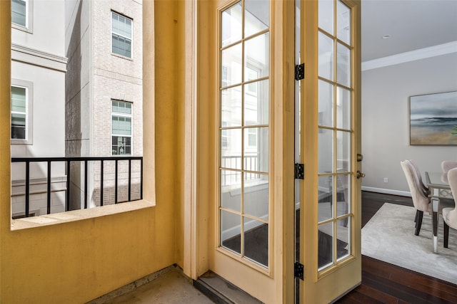 831 Dunleigh Meadows Ln, Houston, TX 77055 - doorway to outside with ornamental molding, wood finished floors, baseboards, and french doors