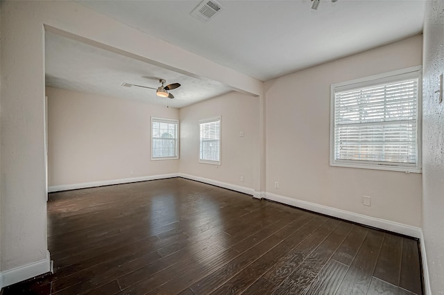 spare room featuring baseboards, hardwood / wood-style flooring, ceiling fan, and baseboard heating