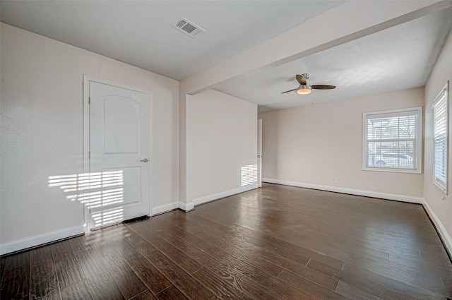 unfurnished room with baseboards, ceiling fan, and dark wood-style floors