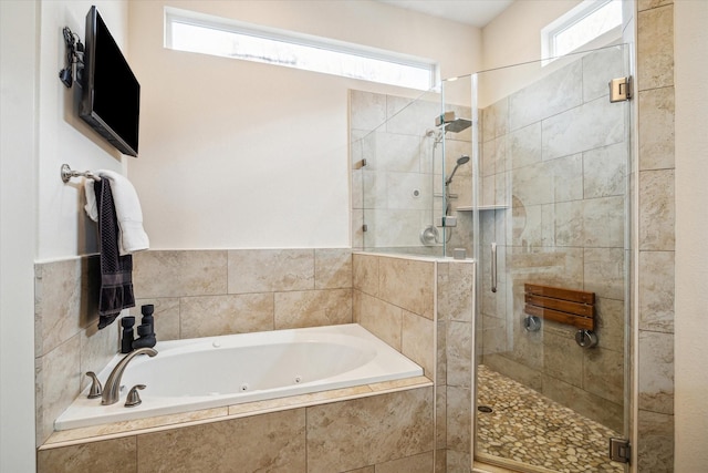 209 Burr St Unit D, Houston, TX 77011 - bathroom featuring a jetted tub, a shower stall, and healthy amount of natural light