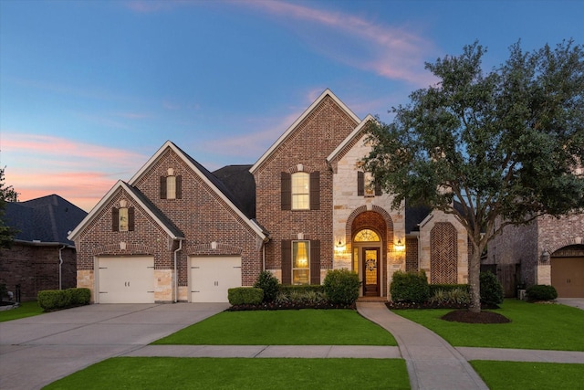 5119 Kendalia Cloud Ln, Fulshear, TX 77441 - view of front facade featuring brick siding, a front lawn, and driveway