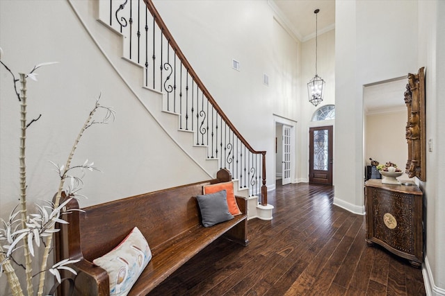 5119 Kendalia Cloud Ln, Fulshear, TX 77441 - entryway with a towering ceiling, crown molding, hardwood / wood-style flooring, stairway, and a chandelier