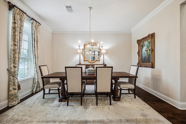 5119 Kendalia Cloud Ln, Fulshear, TX 77441 - dining area with baseboards, wood finished floors, healthy amount of natural light, ornamental molding, and a chandelier