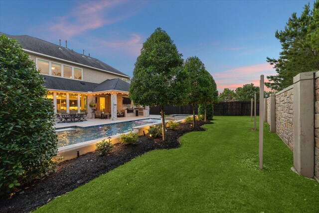 5119 Kendalia Cloud Ln, Fulshear, TX 77441 - yard at dusk with a patio area