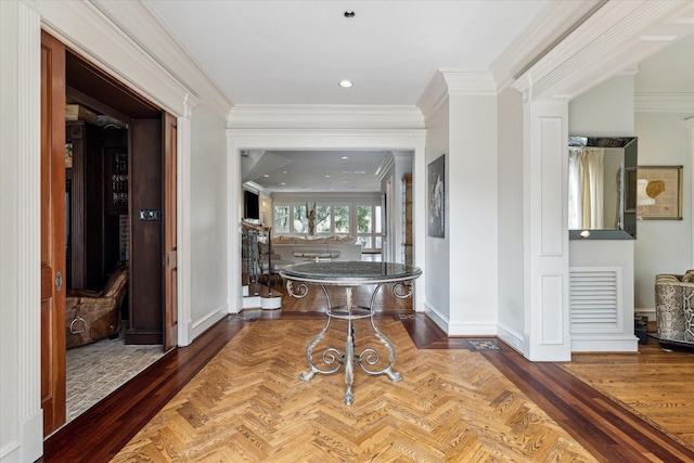 5602 Indian Cir, Houston, TX 77056 - foyer entrance featuring crown molding, ornate columns, and baseboards