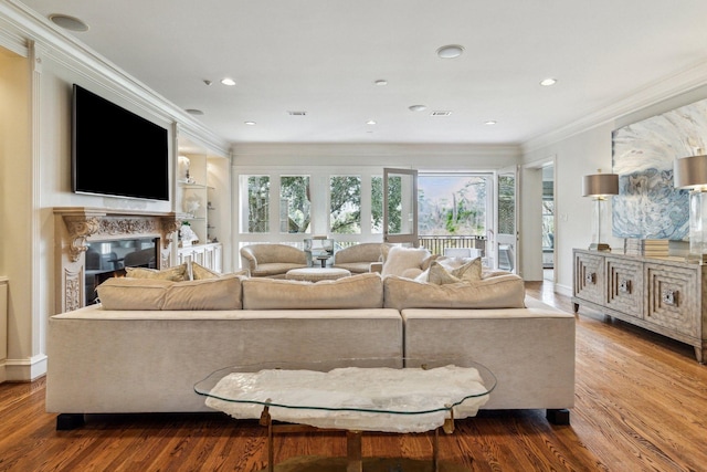 5602 Indian Cir, Houston, TX 77056 - living room featuring wood finished floors, crown molding, a fireplace, recessed lighting, and baseboards