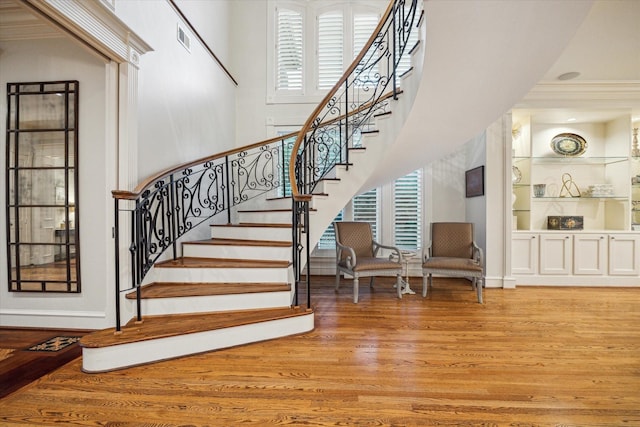5602 Indian Cir, Houston, TX 77056 - stairway with wood finished floors, ornamental molding, built in shelves, and baseboards