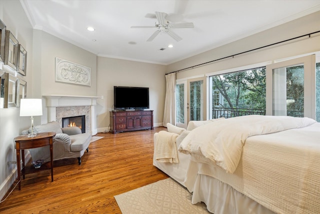 5602 Indian Cir, Houston, TX 77056 - bedroom featuring ornamental molding, wood finished floors, recessed lighting, a fireplace, and a ceiling fan