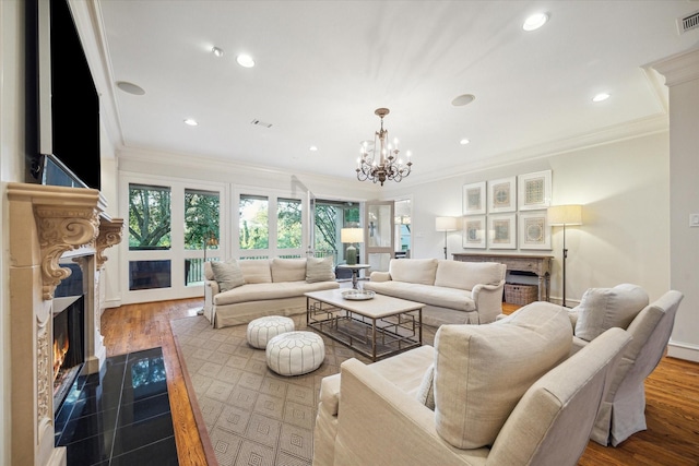 5602 Indian Cir, Houston, TX 77056 - living area featuring a fireplace, crown molding, a chandelier, and recessed lighting