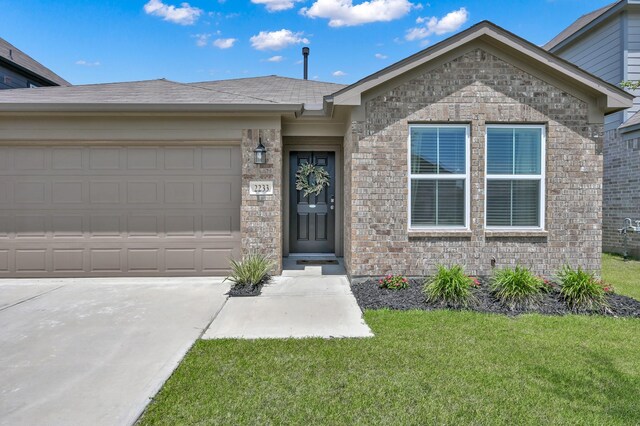 2233 Forest Chestnut Dr, Spring, TX 77386 - ranch-style home with a front lawn, driveway, brick siding, and an attached garage