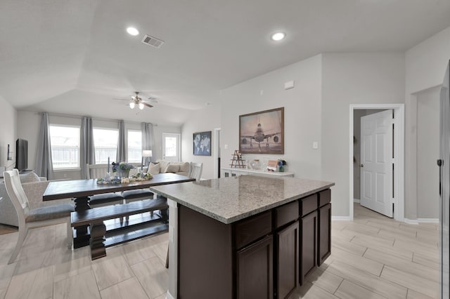 2233 Forest Chestnut Dr, Spring, TX 77386 - kitchen with a ceiling fan, healthy amount of natural light, a kitchen island, open floor plan, and recessed lighting
