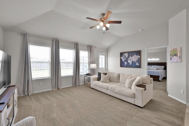 2233 Forest Chestnut Dr, Spring, TX 77386 - living room featuring vaulted ceiling, ceiling fan, plenty of natural light, and light carpet